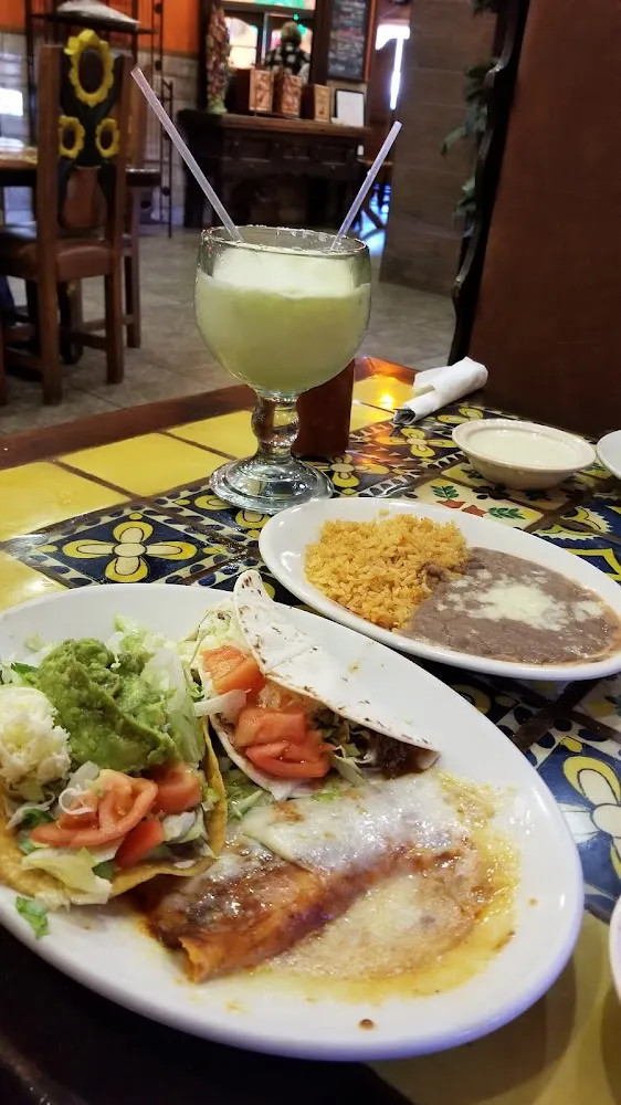 Beans & Rice Lunch Plater of 1 Taco 1 Chalupa 1 Cheese Enchilada and of Course a Frozen Margarita